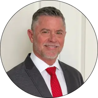 Green headshot of Brandon, marketing manager